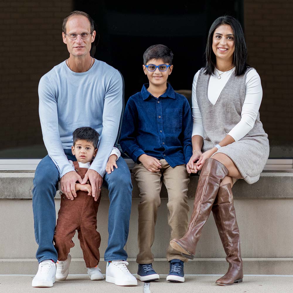 Photo of Costa Tzotzis with his wife and two children
